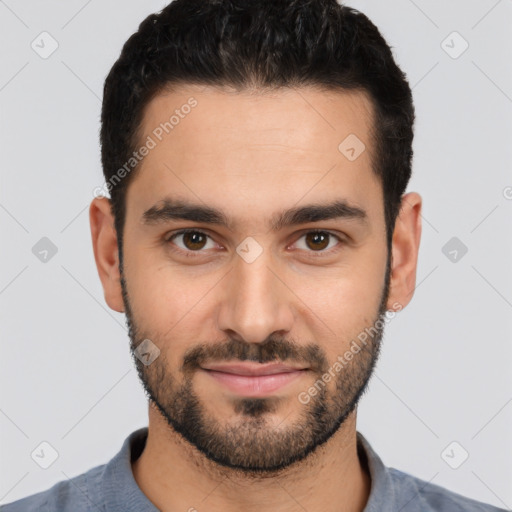 Joyful white young-adult male with short  black hair and brown eyes