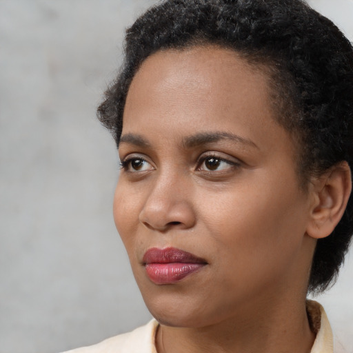 Neutral black young-adult female with short  black hair and brown eyes