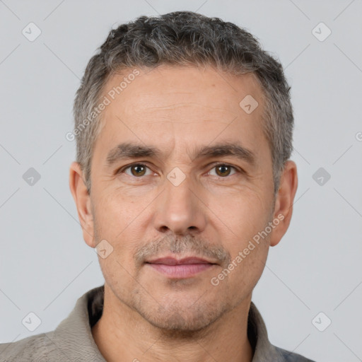 Neutral white adult male with short  black hair and brown eyes