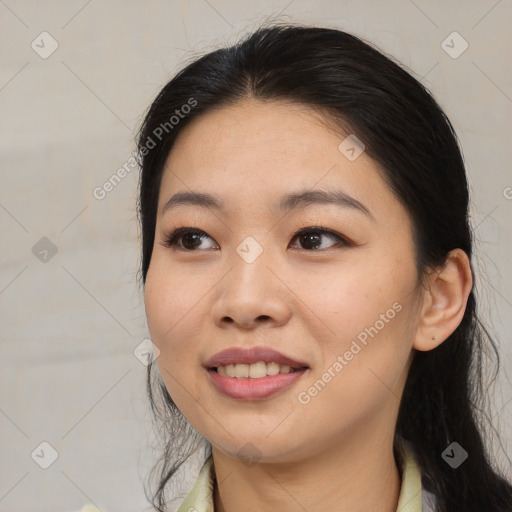 Joyful asian young-adult female with medium  black hair and brown eyes