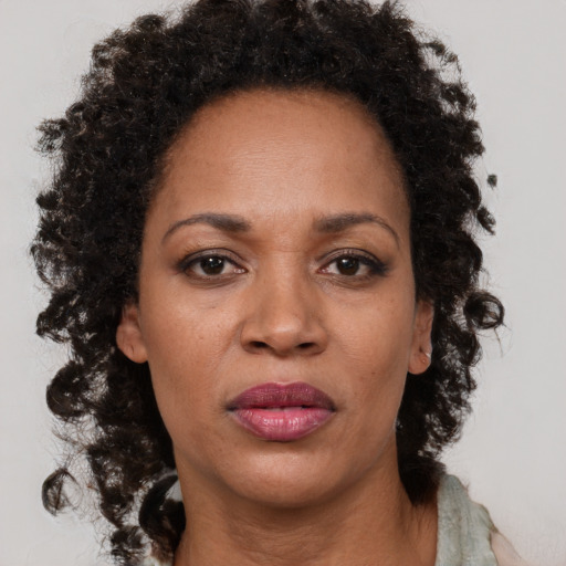 Neutral black adult female with long  brown hair and brown eyes
