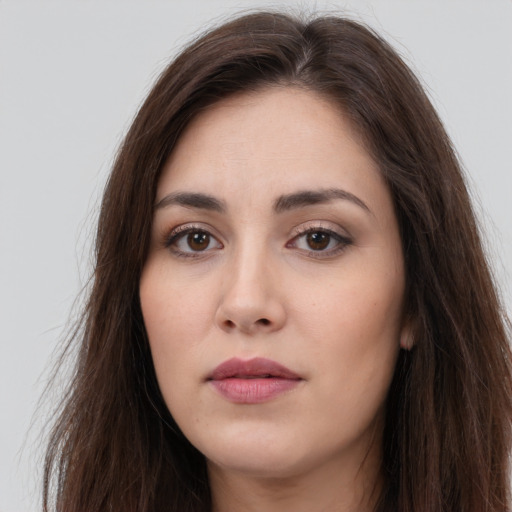 Neutral white young-adult female with long  brown hair and brown eyes