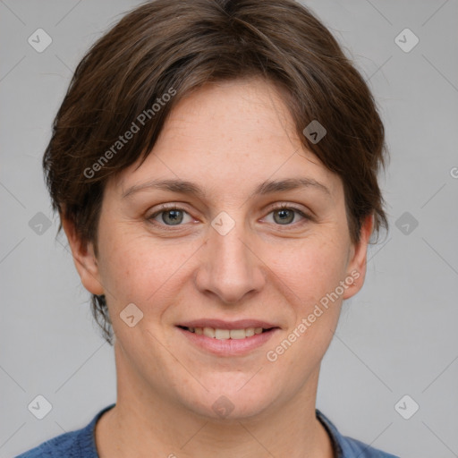 Joyful white adult female with medium  brown hair and grey eyes