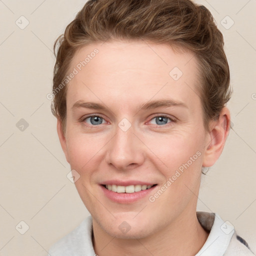 Joyful white young-adult female with short  brown hair and blue eyes