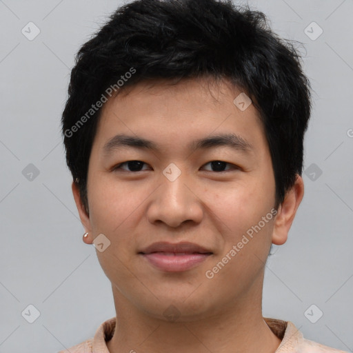 Joyful asian young-adult male with short  black hair and brown eyes