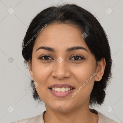 Joyful latino young-adult female with medium  brown hair and brown eyes