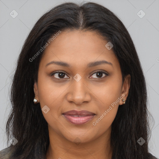 Joyful black young-adult female with long  brown hair and brown eyes