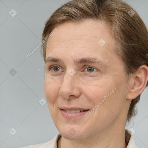 Joyful white adult female with short  brown hair and brown eyes