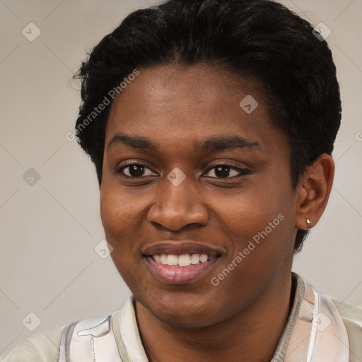 Joyful black young-adult female with short  brown hair and brown eyes