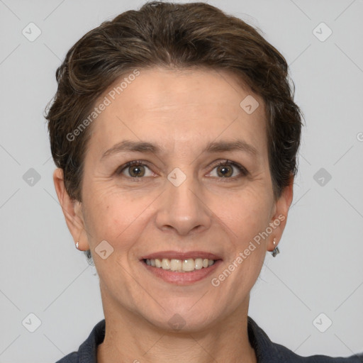 Joyful white adult female with short  brown hair and grey eyes