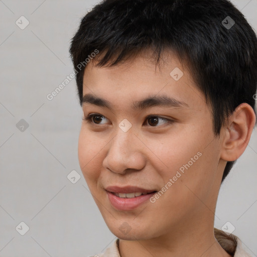 Joyful asian young-adult male with short  brown hair and brown eyes