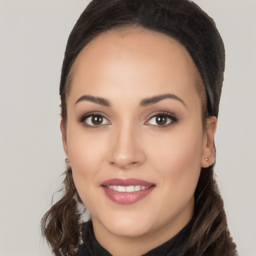 Joyful white young-adult female with long  brown hair and brown eyes