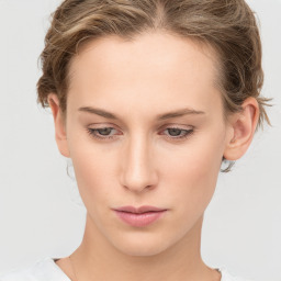 Neutral white young-adult female with medium  brown hair and grey eyes