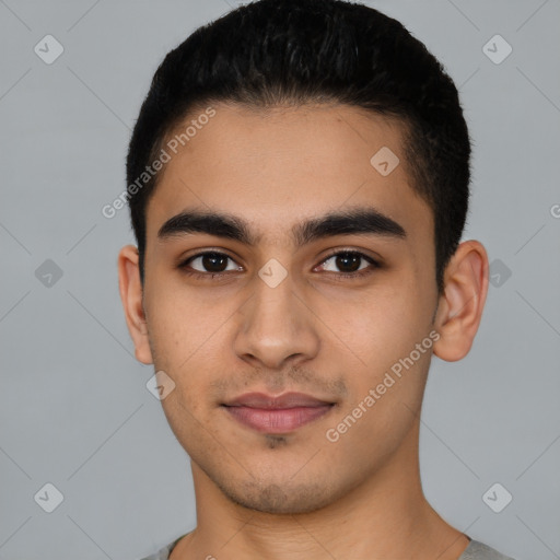 Joyful latino young-adult male with short  black hair and brown eyes