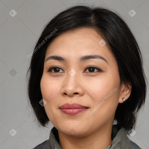 Joyful asian young-adult female with medium  black hair and brown eyes