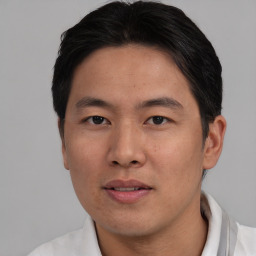 Neutral asian young-adult male with short  brown hair and brown eyes