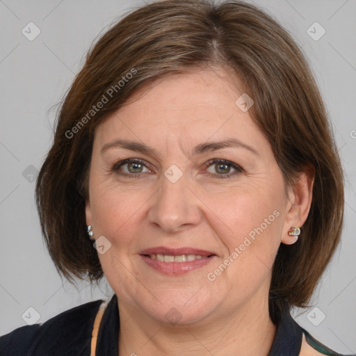 Joyful white adult female with medium  brown hair and brown eyes