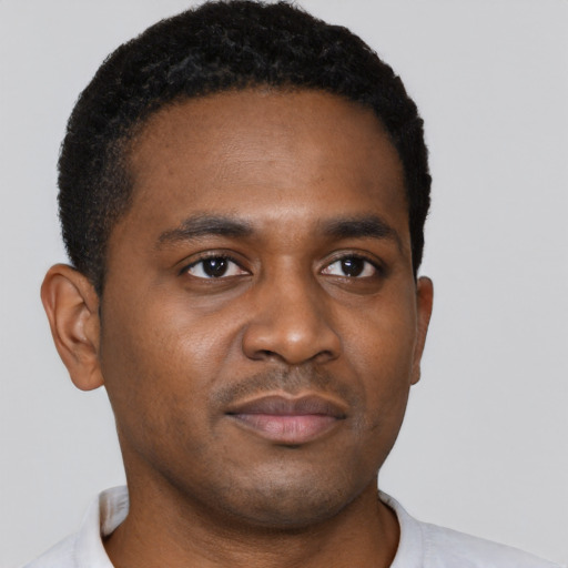 Neutral black young-adult male with short  brown hair and brown eyes