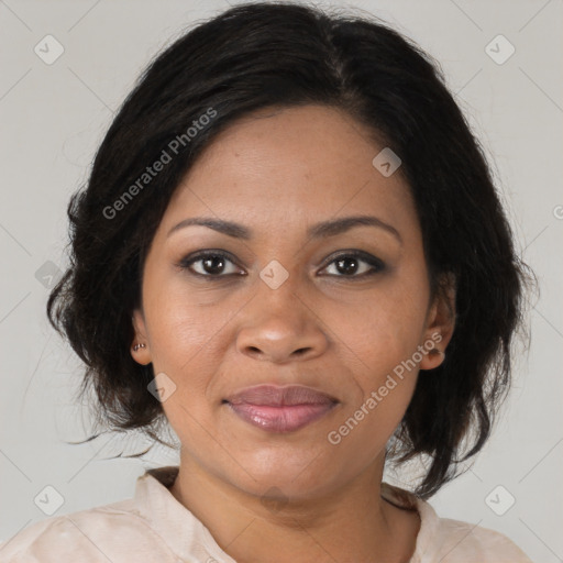 Joyful black adult female with medium  brown hair and brown eyes