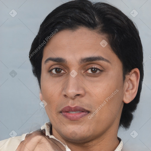 Joyful latino young-adult female with short  brown hair and brown eyes