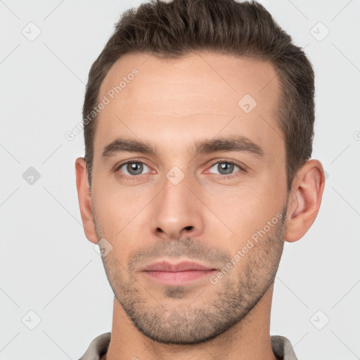 Neutral white young-adult male with short  brown hair and brown eyes