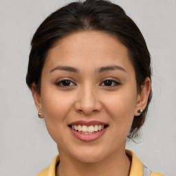 Joyful asian young-adult female with medium  brown hair and brown eyes