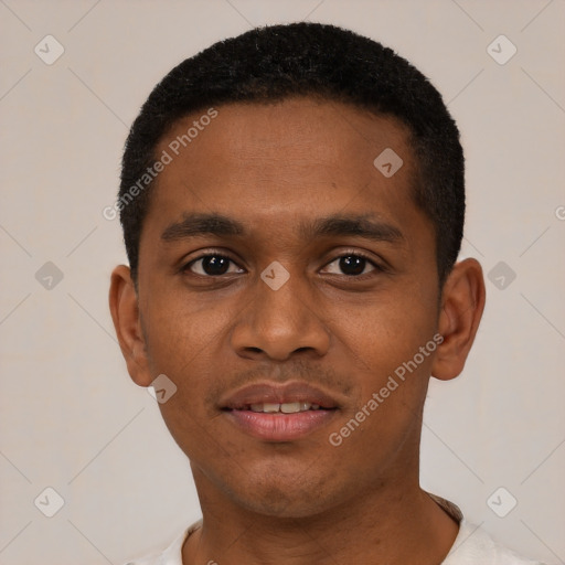 Joyful black young-adult male with short  black hair and brown eyes