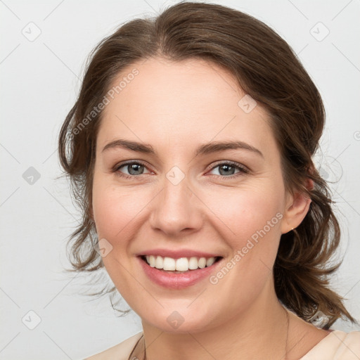 Joyful white young-adult female with medium  brown hair and grey eyes