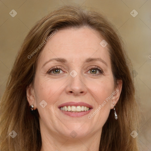 Joyful white adult female with medium  brown hair and green eyes