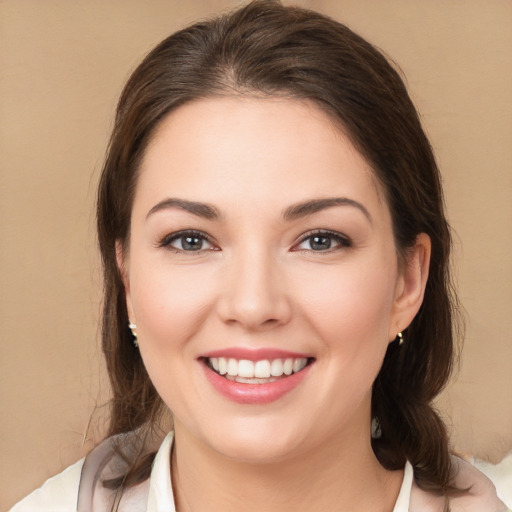 Joyful white young-adult female with medium  brown hair and brown eyes