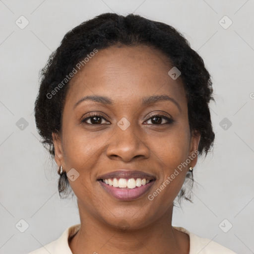 Joyful black young-adult female with medium  brown hair and brown eyes