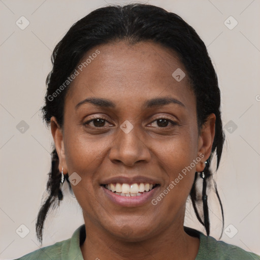 Joyful black adult female with medium  brown hair and brown eyes