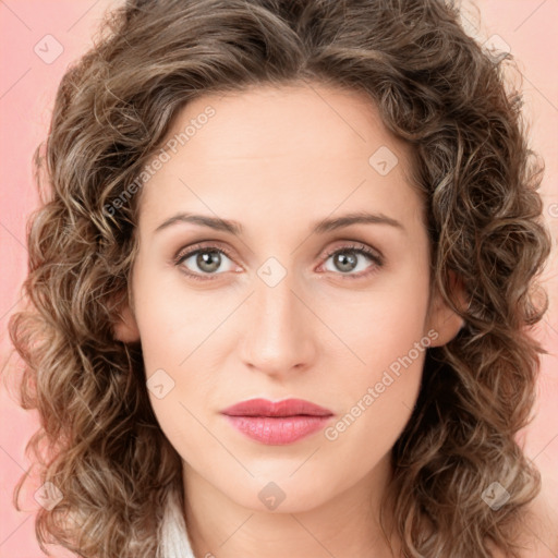 Joyful white young-adult female with medium  brown hair and green eyes