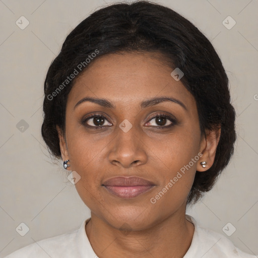 Joyful black young-adult female with medium  brown hair and brown eyes