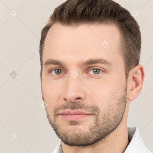 Joyful white young-adult male with short  brown hair and brown eyes