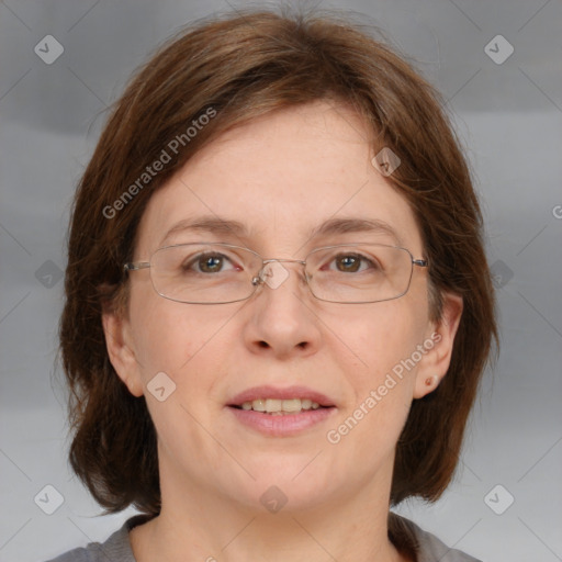 Joyful white adult female with medium  brown hair and blue eyes