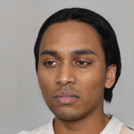 Neutral black young-adult male with short  black hair and brown eyes