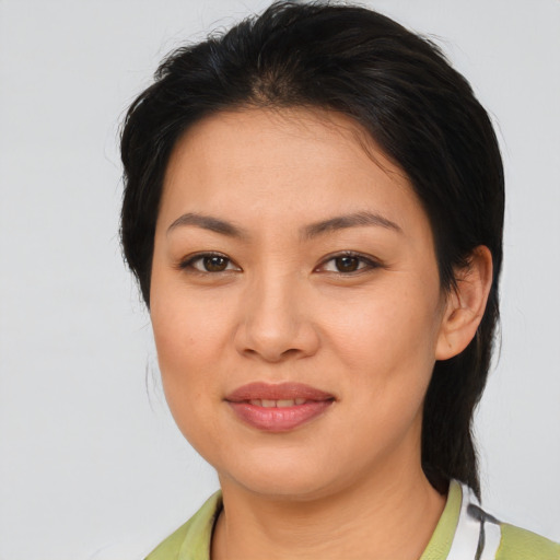 Joyful asian young-adult female with medium  brown hair and brown eyes