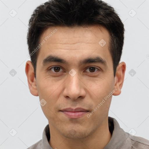 Joyful white adult male with short  brown hair and brown eyes