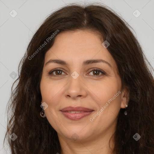 Joyful white adult female with long  brown hair and brown eyes