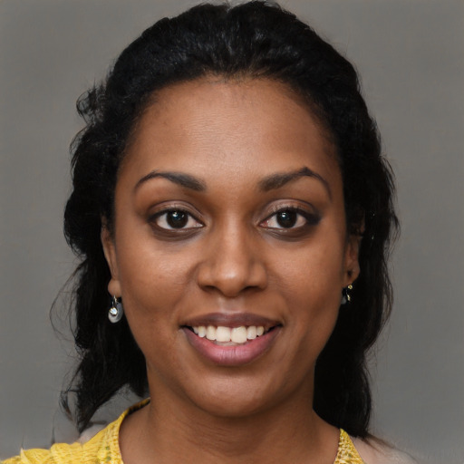Joyful black young-adult female with medium  black hair and brown eyes
