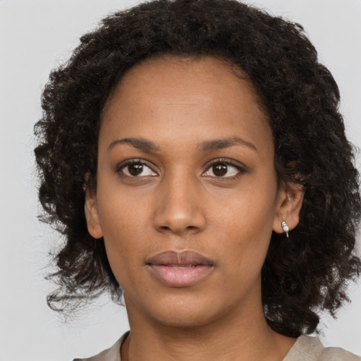 Neutral black young-adult female with long  black hair and brown eyes