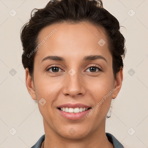 Joyful white young-adult female with short  brown hair and brown eyes