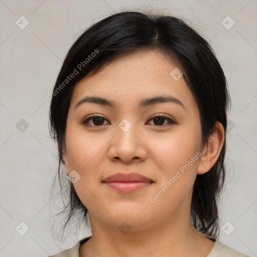 Joyful latino young-adult female with medium  black hair and brown eyes