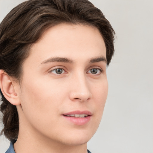 Joyful white young-adult male with medium  brown hair and brown eyes