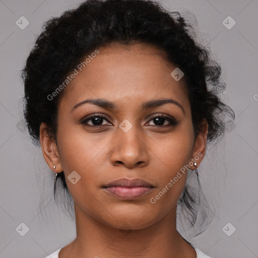 Joyful black young-adult female with medium  brown hair and brown eyes