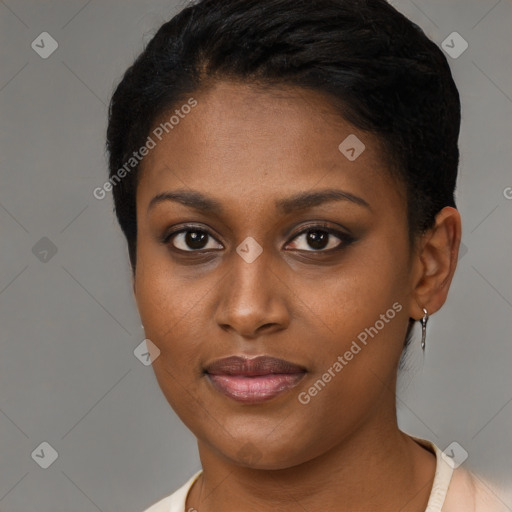 Joyful black young-adult female with short  brown hair and brown eyes