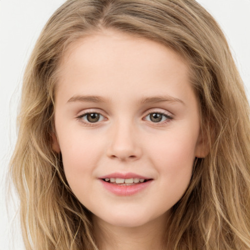 Joyful white child female with long  brown hair and brown eyes