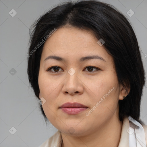 Joyful asian adult female with medium  brown hair and brown eyes