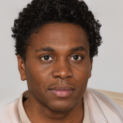 Neutral black young-adult male with short  brown hair and brown eyes
